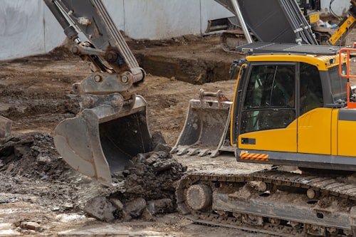 Excavator digging construction site foundation, Rawalpindi
